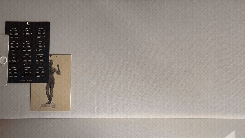 Gif of Sarah King calligrapher and designer pinning items on a bulletin board