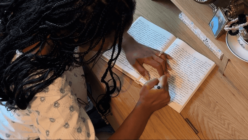 gif blog in-line image of sarah writing in diary